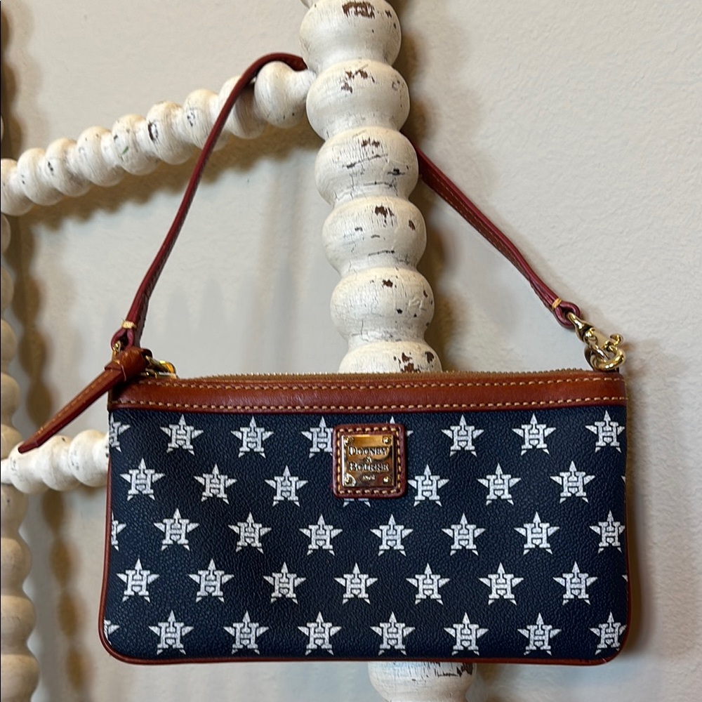 Dooney & Bourke Navy -white Houston Astro’s  and Brown Wristlet
Excellent